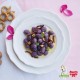 Gnocchis violets avec fondue au fromage, speck et noix